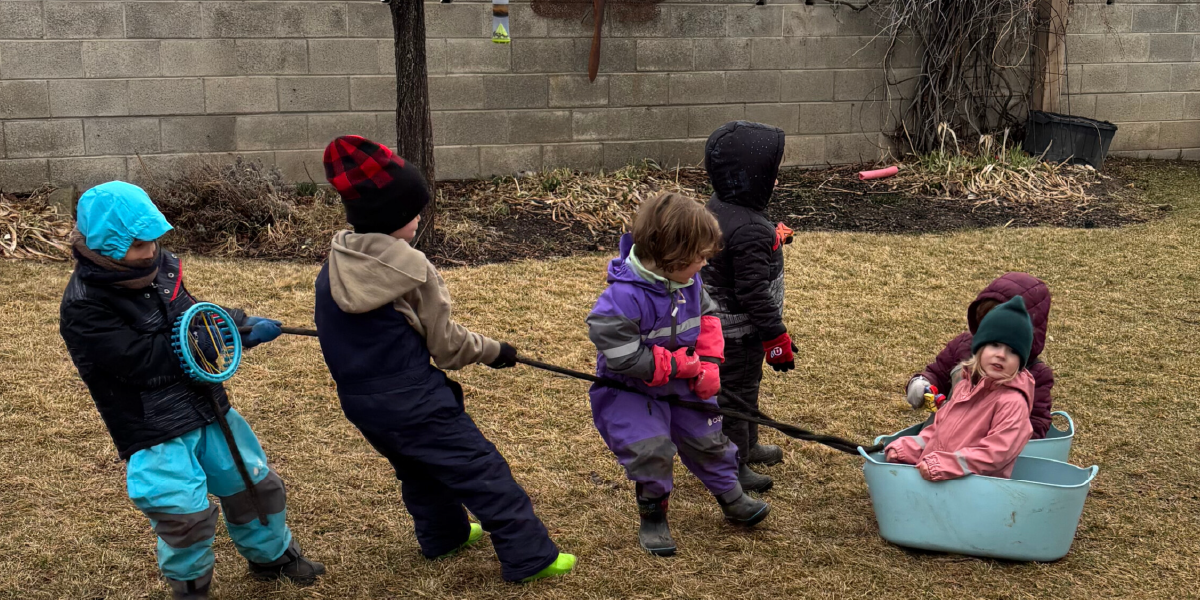 Children playing with a parachute outdoors